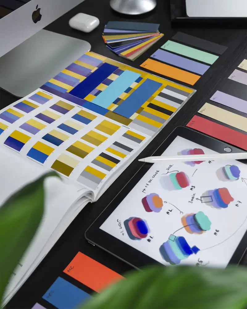 Designer workspace with brand color swatches and creative tools