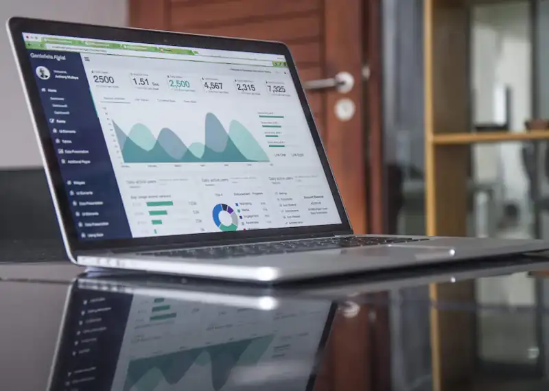 Web analytics dashboard on a laptop representing custom web development